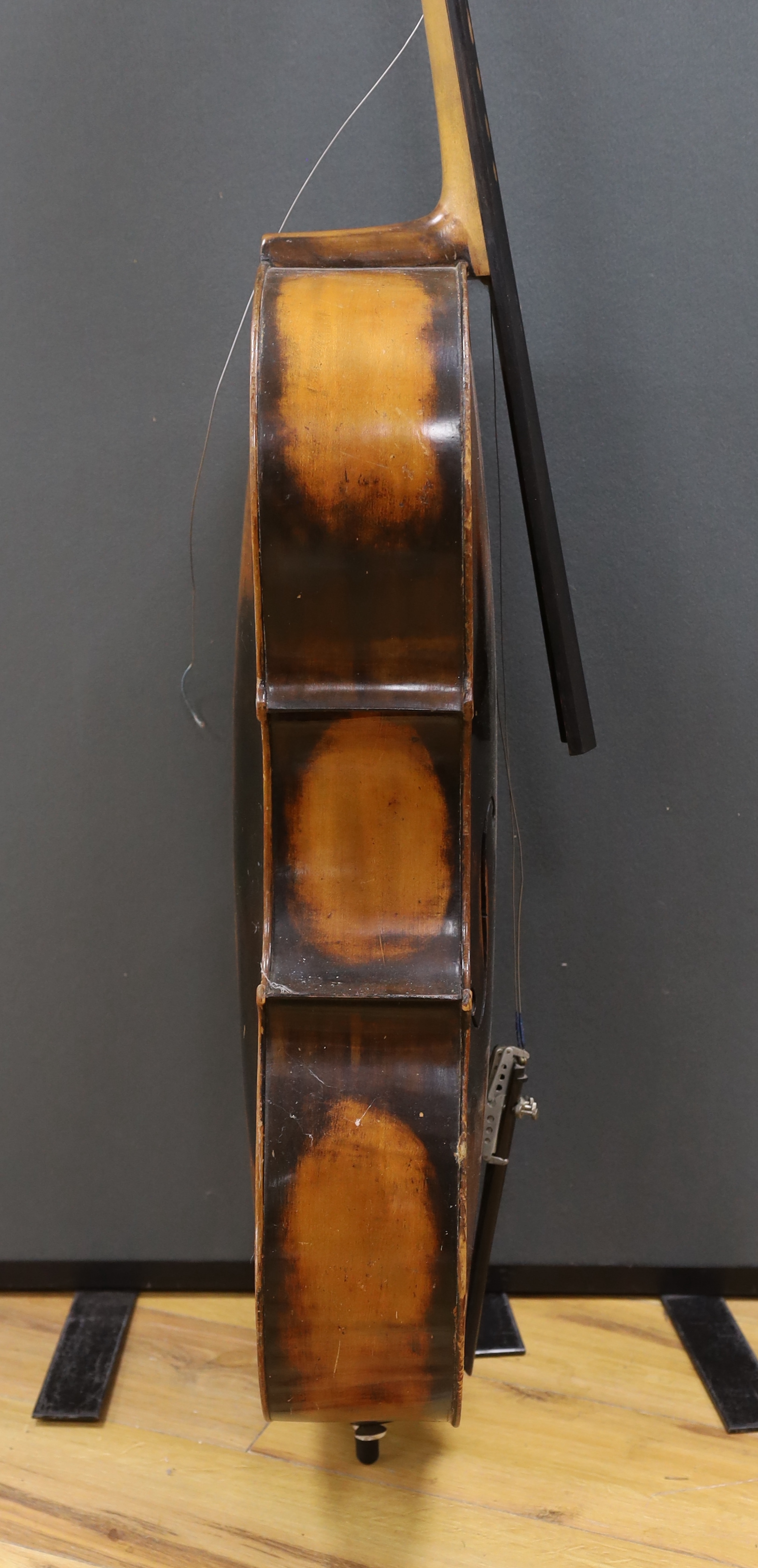 A full size cello labelled Adolf Stowaller, cased, 132cm high